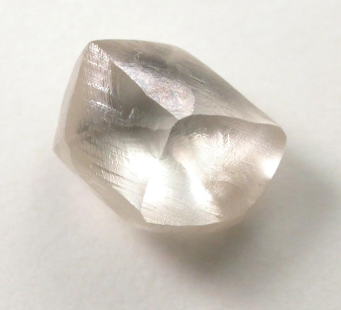 Diamond (1.40 carat champagne-colored distorted cuttable dodecahedral crystal) from Damtshaa Mine, near Orapa, Botswana
