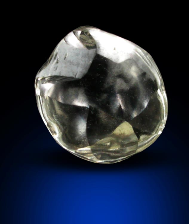 Diamond (0.69 carat pale-yellow flattened crystal) from Argyle Mine, Kimberley, Western Australia, Australia