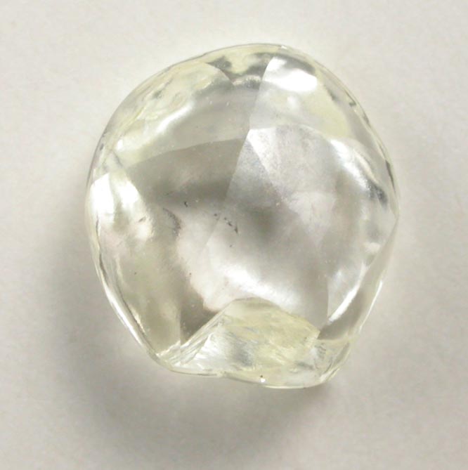 Diamond (0.69 carat pale-yellow flattened crystal) from Argyle Mine, Kimberley, Western Australia, Australia