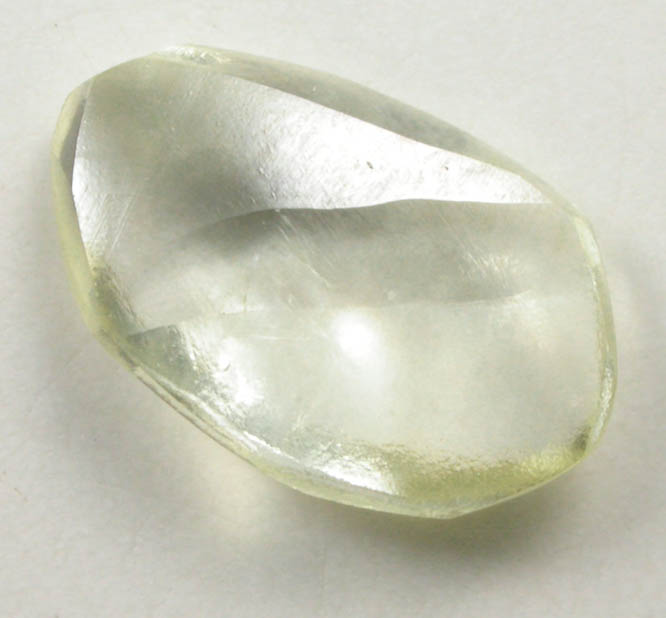 Diamond (0.68 carat pale-yellow flattened crystal) from Argyle Mine, Kimberley, Western Australia, Australia