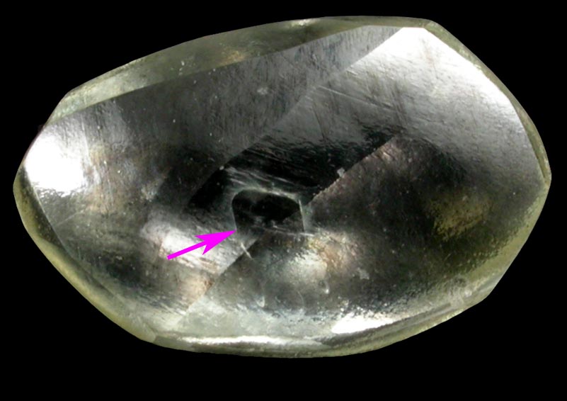Diamond (0.68 carat pale-yellow flattened crystal) from Argyle Mine, Kimberley, Western Australia, Australia