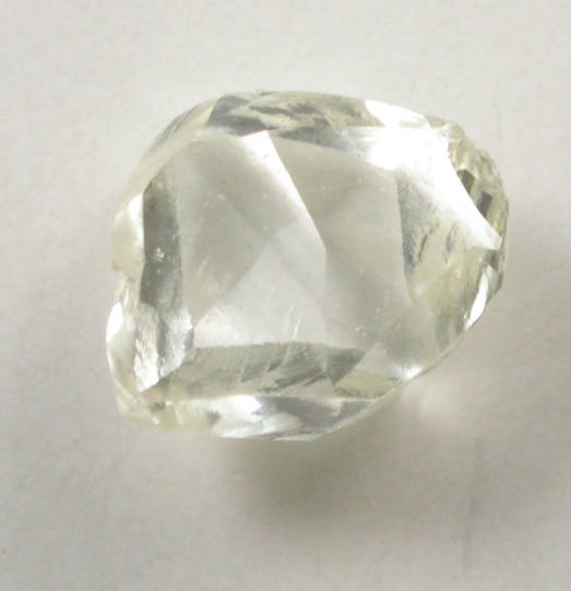 Diamond (0.37 carat pale-yellow flattened irregular crystal) from Argyle Mine, Kimberley, Western Australia, Australia