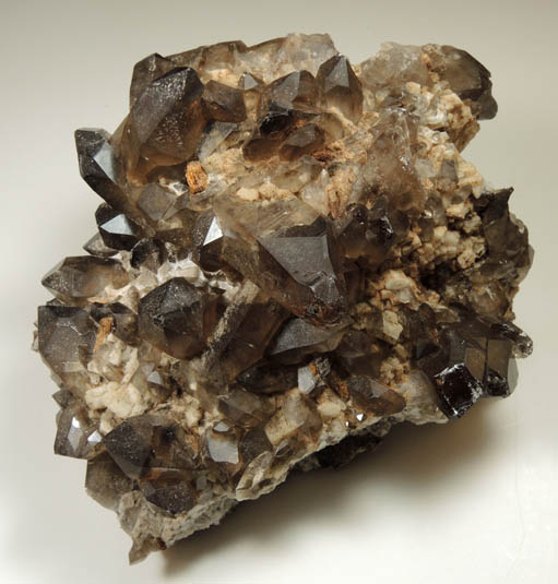 Quartz var. Smoky Quartz (Dauphin-law twins) on Microcline from Moat Mountain, west of North Conway, Carroll County, New Hampshire