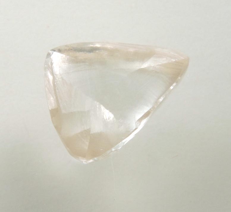 Diamond (0.92 carat pale-brown triangular crystal) from Argyle Mine, Kimberley, Western Australia, Australia