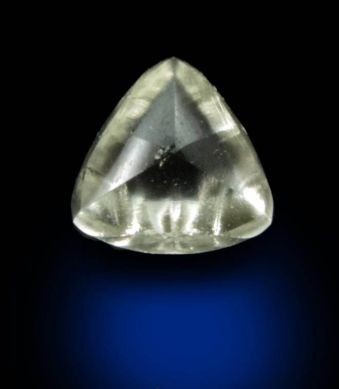 Diamond (0.65 carat cuttable yellow distorted triangular crystal) from Orapa Mine, south of the Makgadikgadi Pans, Botswana