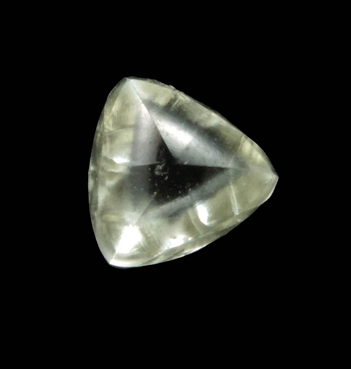 Diamond (0.65 carat cuttable yellow distorted triangular crystal) from Orapa Mine, south of the Makgadikgadi Pans, Botswana