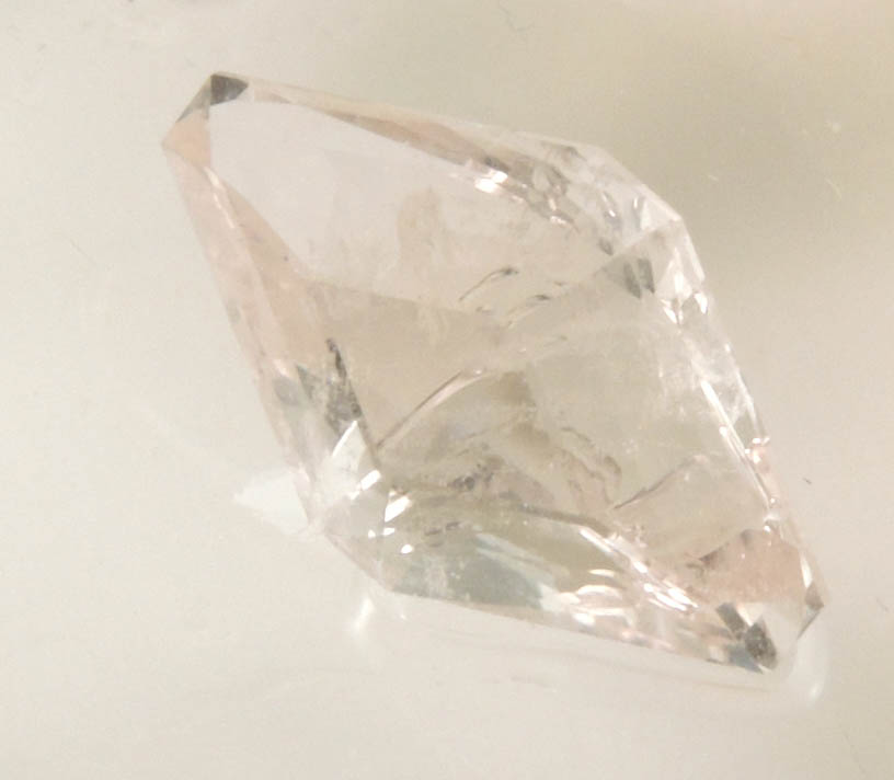 Beryl var. Morganite (three faceted gemstones totaling 5.53 carats with rough) from Haddam Neck, Middlesex County, Connecticut