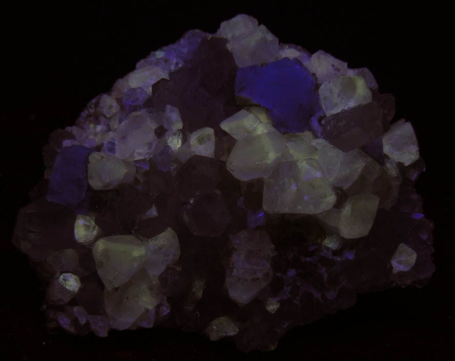 Photo below under shortwave ultraviolet illumination of Topaz and Quartz with Fluorite from Second Sovietskiy Mine, Dalnegorsk, Primorskiy Kray, Russia Topaz and Quartz with Fluorite from Second Sovietskiy Mine, Dalnegorsk, Primorskiy Kray, Russia