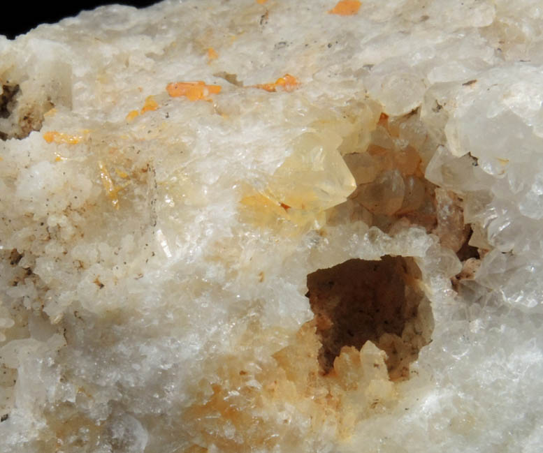 Wulfenite on Quartz with mold after Galena from Manhan Lead Mines, Loudville District, 3 km northwest of Easthampton, Hampshire County, Massachusetts