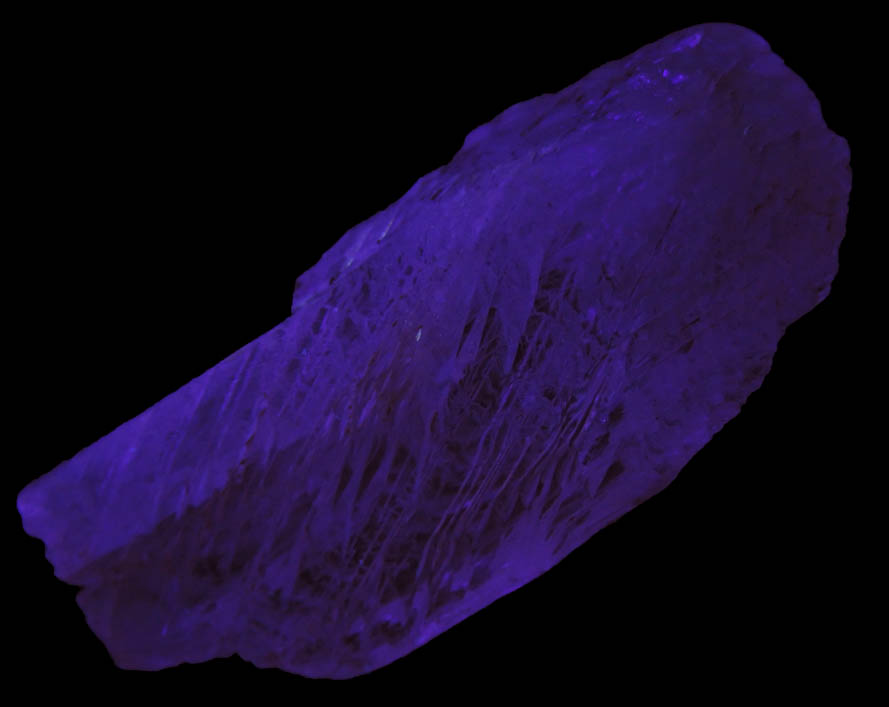 Photo below under shortwave ultraviolet illumination of Spodumene var. Kunzite from Pala Chief Mine, Pala District, San Diego County, California Spodumene var. Kunzite from Pala Chief Mine, Pala District, San Diego County, California