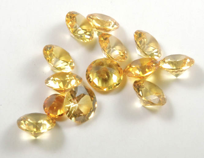 Synthetic Yellow Topaz (13 faceted gemstones totaling 3.63 carats) from Brazil