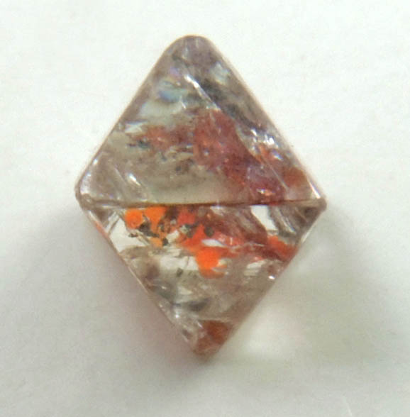 Diamond (0.32 carat octahedral crystal with red inclusions) from Sakha (Yakutia) Republic, Siberia, Russia