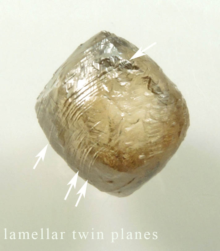 Diamond (2.36 carat gray-brown dodecahedral rough uncut diamond) from Damtshaa Mine, near Orapa, Botswana