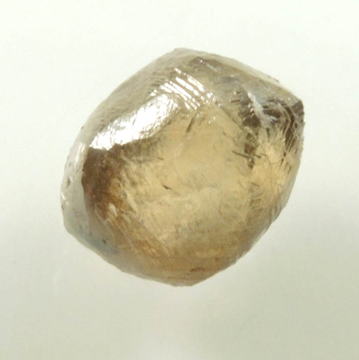 Diamond (2.36 carat gray-brown dodecahedral rough uncut diamond) from Damtshaa Mine, near Orapa, Botswana