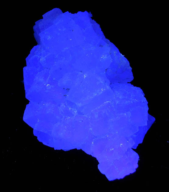 Photo below under longwave ultraviolet illumination of Fluorite over Quartz from Hardy Mine, Oatman District, Mohave County, Arizona Fluorite over Quartz from Hardy Mine, Oatman District, Mohave County, Arizona