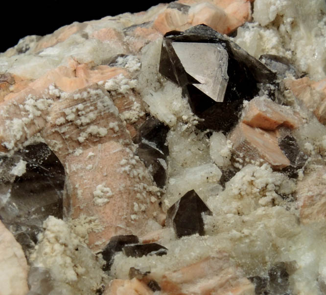 Microcline, Albite, Smoky Quartz, Hyalite Opal from Moat Mountain, on the trail above the Oliver Diggings, Hale's Location, west of North Conway, Carroll County, New Hampshire