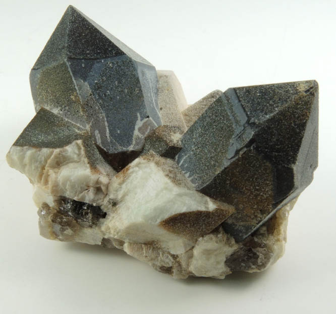 Quartz var. Smoky Quartz (Dauphiné-law twin) on Microcline from Hurricane Mountain, east of Intervale, Carroll County, New Hampshire
