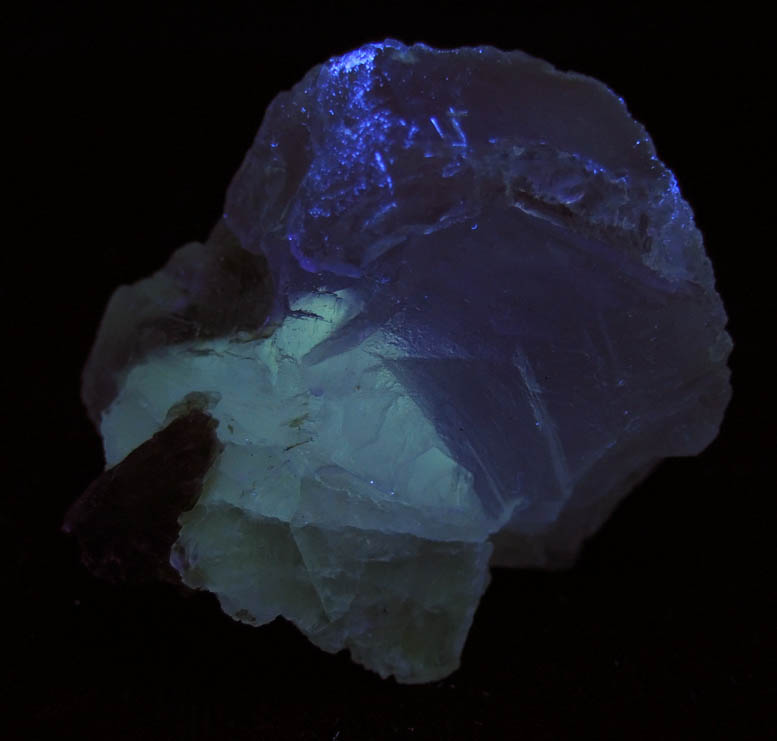 Photo below under shortwave ultraviolet illumination of Fluorite with minor Muscovite from Chumar Bakhoor, Nagar, Gilgit-Baltistan, Pakistan Fluorite with minor Muscovite from Chumar Bakhoor, Nagar, Gilgit-Baltistan, Pakistan