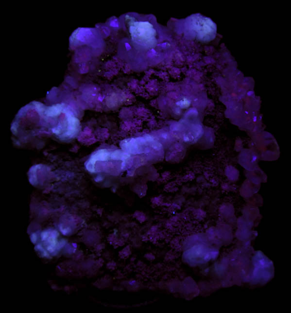 Photo below under shortwave ultraviolet illumination of Analcime with Stilbite and Calcite on Quartz from New Street Quarry, Paterson, Passaic County, New Jersey Analcime with Stilbite and Calcite on Quartz from New Street Quarry, Paterson, Passaic County, New Jersey