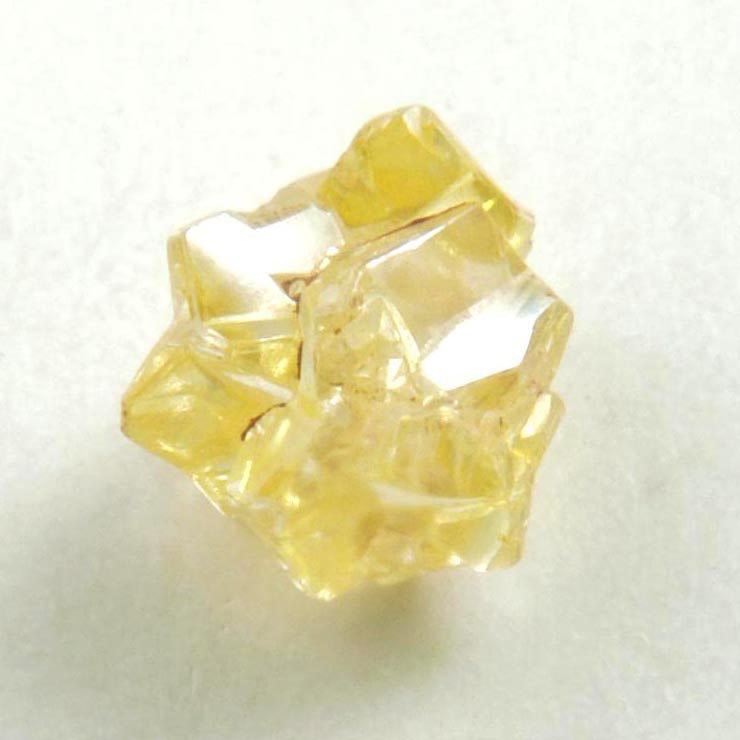 Diamond (0.39 carat cluster of fancy-yellow cavernous uncut rough diamonds) from Mbuji-Mayi, 300 km east of Tshikapa, Democratic Republic of the Congo