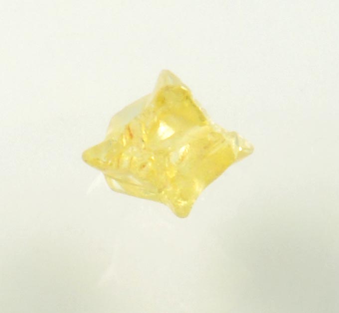 Diamond (0.25 carat fancy-yellow cavernous uncut diamond) from Mbuji-Mayi, 300 km east of Tshikapa, Democratic Republic of the Congo