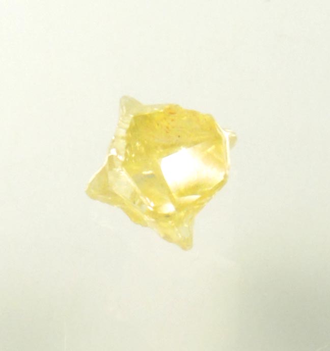 Diamond (0.25 carat fancy-yellow cavernous uncut diamond) from Mbuji-Mayi, 300 km east of Tshikapa, Democratic Republic of the Congo