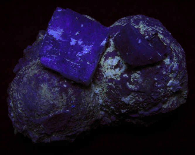 Photo below under shortwave ultraviolet illumination of Apophyllite on Pectolite over Amethyst Quartz from Prospect Park Quarry, Prospect Park, Passaic County, New Jersey Apophyllite on Pectolite over Amethyst Quartz from Prospect Park Quarry, Prospect Park, Passaic County, New Jersey