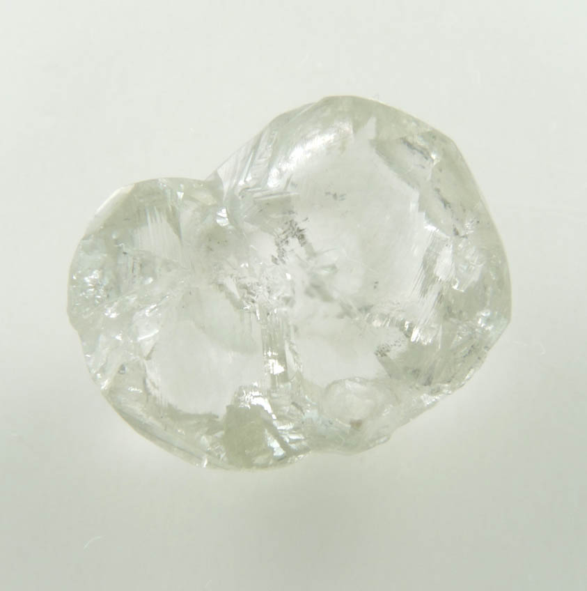 Diamond (4.50 carat pale-gray flattened complex uncut diamond cluster) from Oranjemund District, southern coastal Namib Desert, Namibia