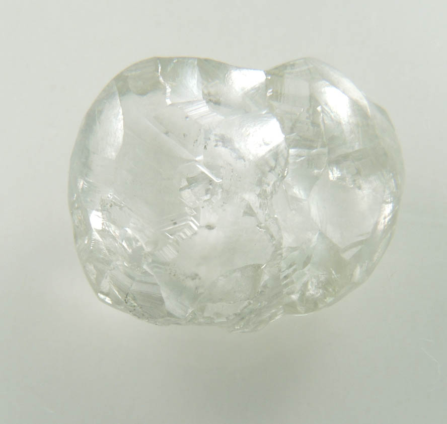 Diamond (4.50 carat pale-gray flattened complex uncut diamond cluster) from Oranjemund District, southern coastal Namib Desert, Namibia