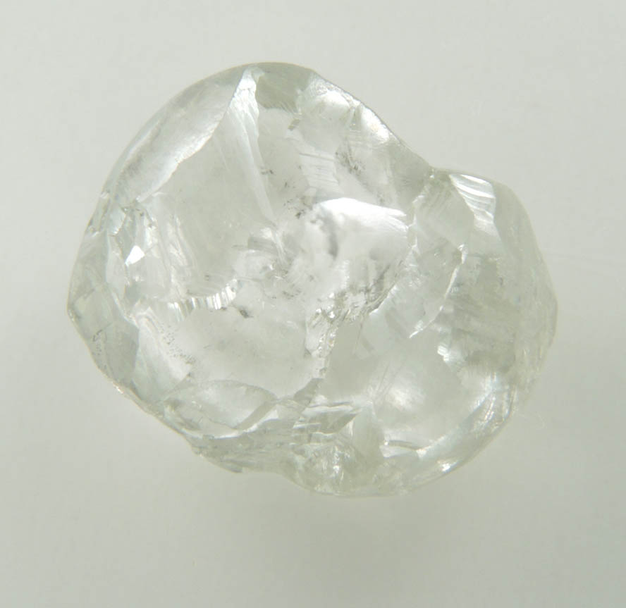 Diamond (4.50 carat pale-gray flattened complex uncut diamond cluster) from Oranjemund District, southern coastal Namib Desert, Namibia