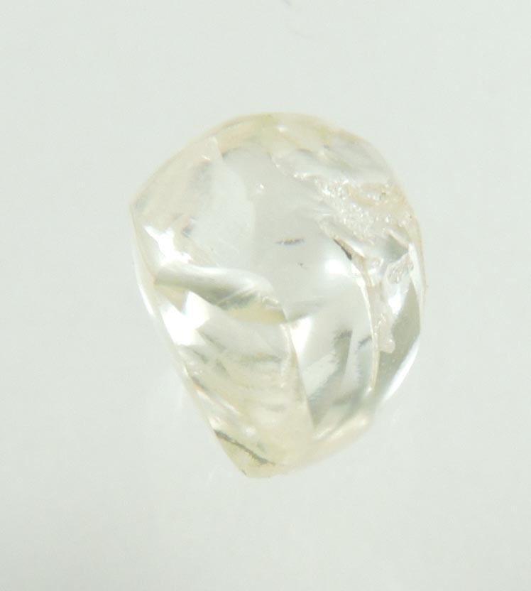 Diamond (0.66 carat cuttable pale-yellow complex rough diamond) from Orapa Mine, south of the Makgadikgadi Pans, Botswana