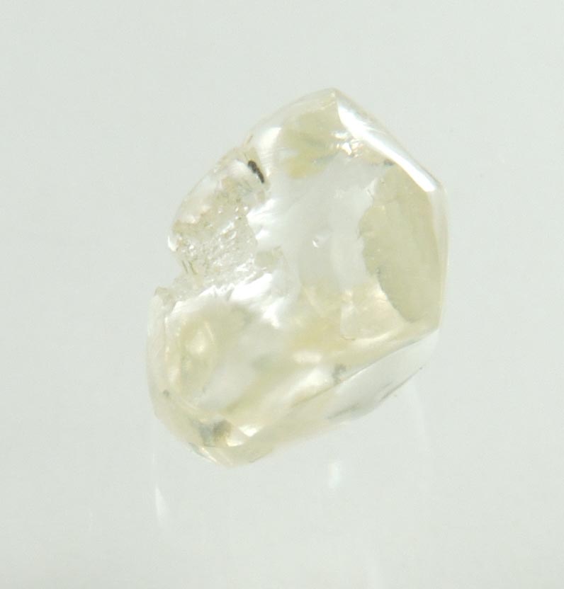 Diamond (0.66 carat cuttable pale-yellow complex rough diamond) from Orapa Mine, south of the Makgadikgadi Pans, Botswana
