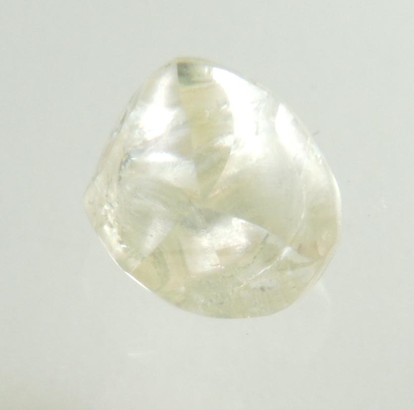 Diamond (0.66 carat cuttable pale-yellow complex rough diamond) from Orapa Mine, south of the Makgadikgadi Pans, Botswana