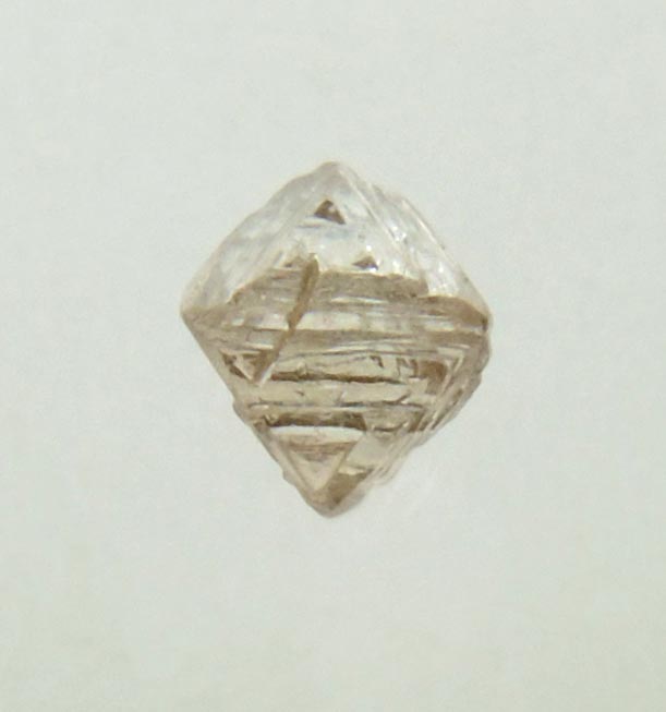 Diamond (0.14 carat brown octahedral crystal) from Fuxian, Lianing Province, China