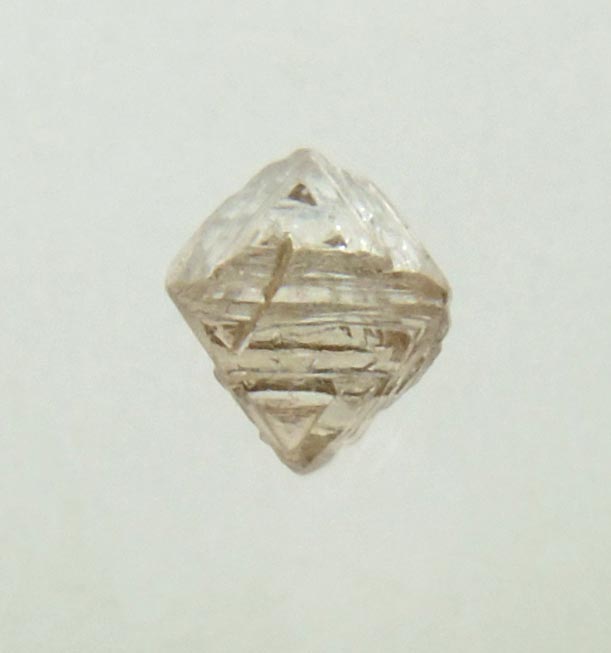 Diamond (0.14 carat brown octahedral crystal) from Fuxian, Lianing Province, China