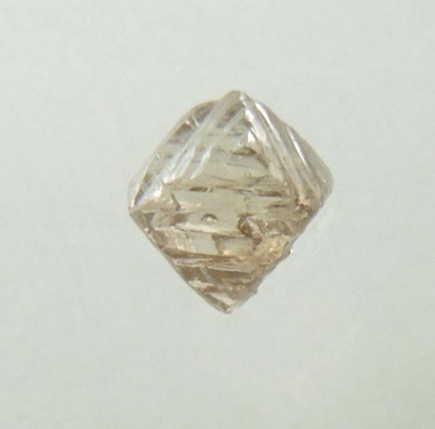 Diamond (0.14 carat brown octahedral crystal) from Fuxian, Lianing Province, China