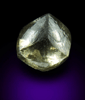 Diamond (1.29 carat fancy yellowish-green flattened dodecahedral uncut diamond) from Oranjemund District, southern coastal Namib Desert, Namibia
