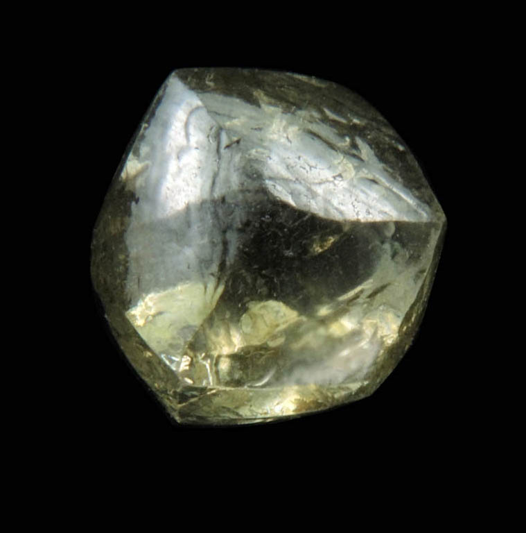 Diamond (1.29 carat fancy yellowish-green flattened dodecahedral uncut diamond) from Oranjemund District, southern coastal Namib Desert, Namibia