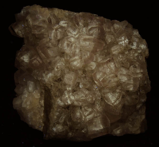 Photo below under longwave ultraviolet illumination of Calcite with Goethite and Pyrite inclusions from Kentucky Stone Quarry, Flemingsburg, Fleming County, Kentucky Calcite with Goethite and Pyrite inclusions from Kentucky Stone Quarry, Flemingsburg, Fleming County, Kentucky