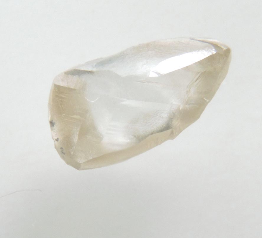 Diamond (1.27 carat pale-brown elongated macle, twinned uncut diamond) from Northern Cape Province, South Africa