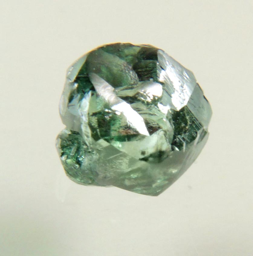 Diamond (0.93 carat fancy-intense green complex uncut diamond) from Almazy Anabara Mine, Sakha (Yakutia) Republic, Siberia, Russia