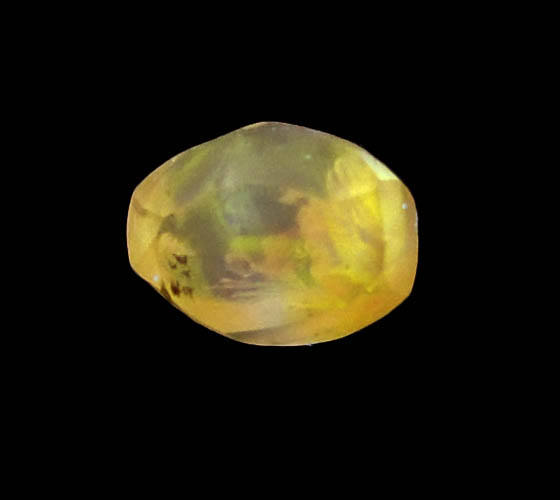 Photo below under longwave ultraviolet illumination of Diamond (0.97 carat fancy orange-brown elongated dodecahedral uncut diamond) from Northern Cape Province, South Africa Diamond (0.97 carat fancy orange-brown elongated dodecahedral uncut diamond) from Northern Cape Province, South Africa