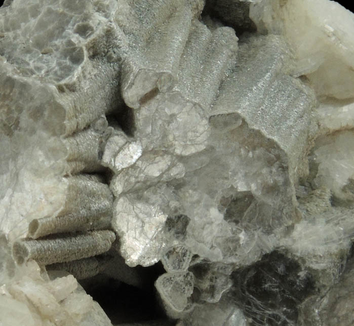 Muscovite (columnar crystals) on Albite var. Cleavelandite from Emmons Quarry, southeastern slope of Uncle Tom Mountain,  Greenwood, Oxford County, Maine