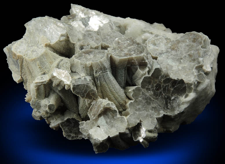 Muscovite (columnar crystals) on Albite var. Cleavelandite from Emmons Quarry, southeastern slope of Uncle Tom Mountain,  Greenwood, Oxford County, Maine