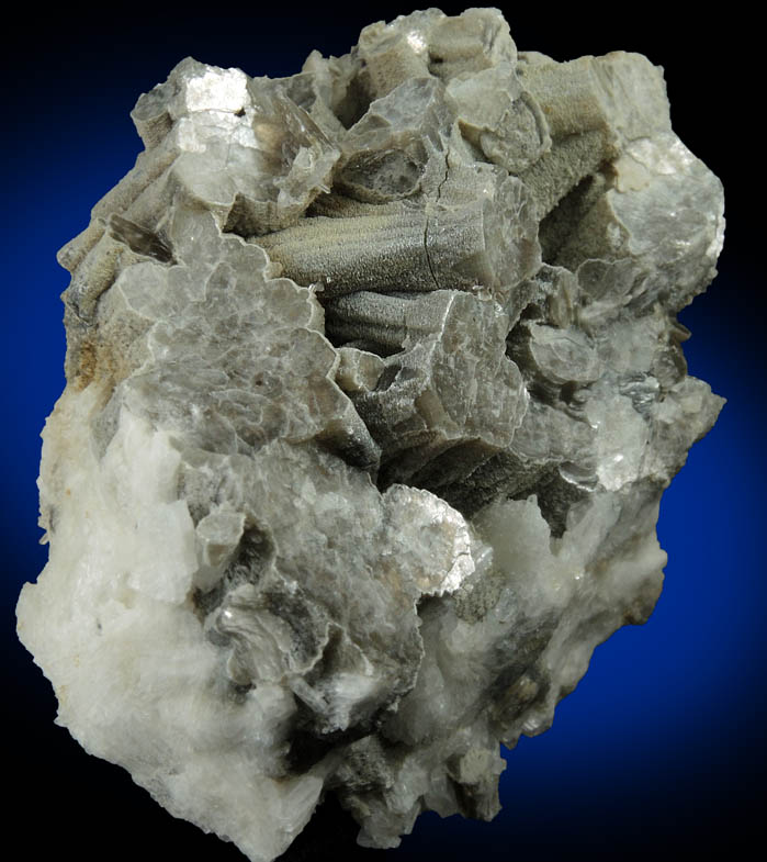 Muscovite (columnar crystals) on Albite var. Cleavelandite from Emmons Quarry, southeastern slope of Uncle Tom Mountain,  Greenwood, Oxford County, Maine