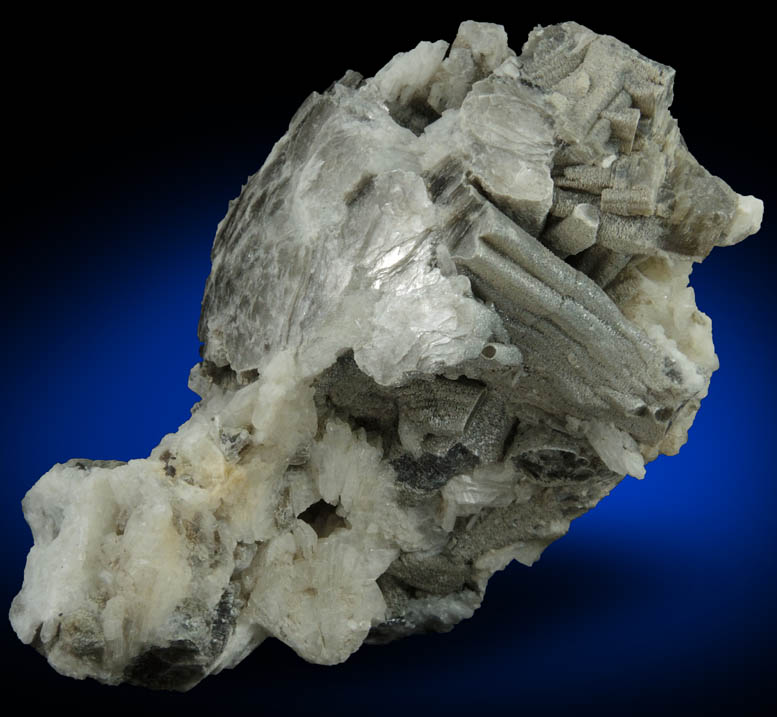 Muscovite (columnar crystals) on Albite var. Cleavelandite from Emmons Quarry, southeastern slope of Uncle Tom Mountain,  Greenwood, Oxford County, Maine