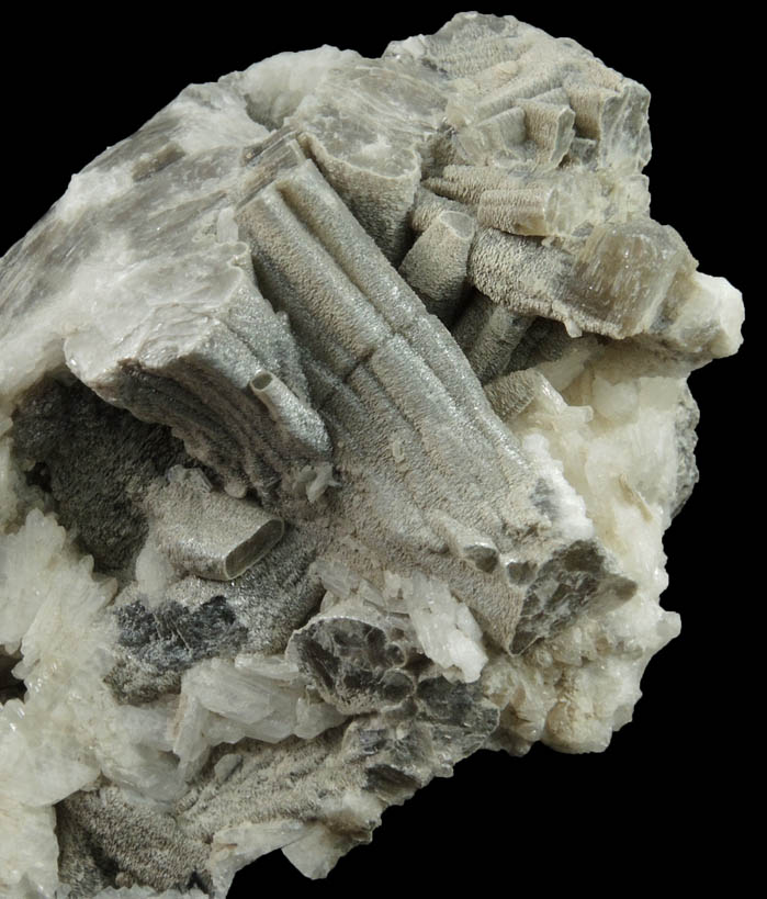 Muscovite (columnar crystals) on Albite var. Cleavelandite from Emmons Quarry, southeastern slope of Uncle Tom Mountain,  Greenwood, Oxford County, Maine