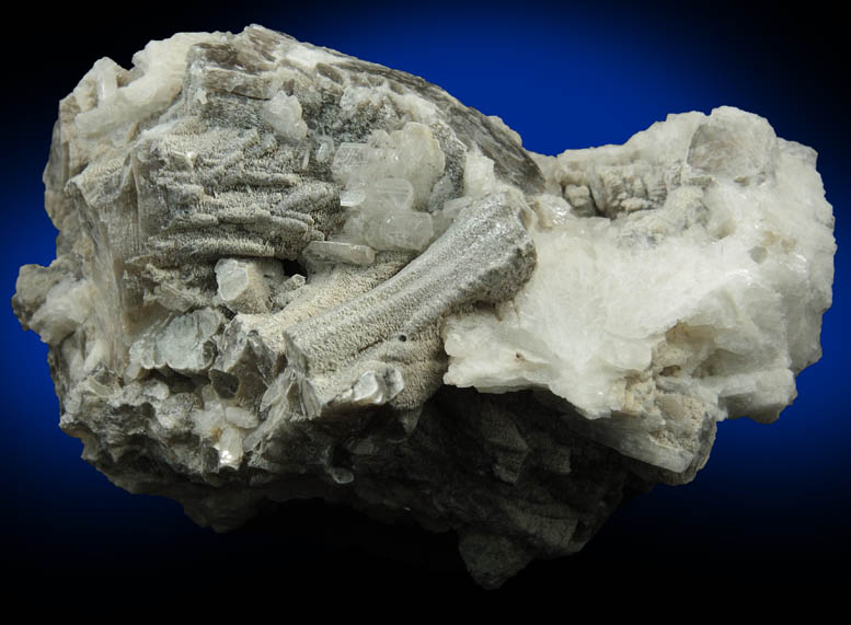 Muscovite (columnar crystals) on Albite var. Cleavelandite from Emmons Quarry, southeastern slope of Uncle Tom Mountain,  Greenwood, Oxford County, Maine