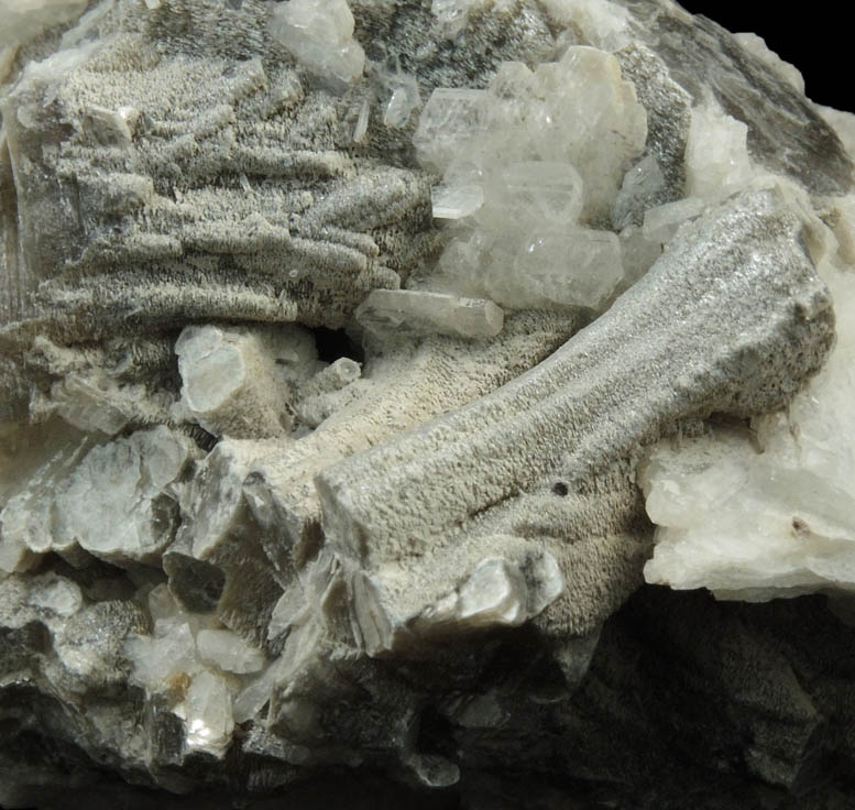 Muscovite (columnar crystals) on Albite var. Cleavelandite from Emmons Quarry, southeastern slope of Uncle Tom Mountain,  Greenwood, Oxford County, Maine