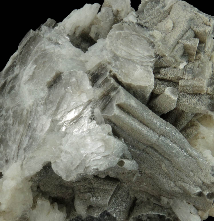 Muscovite (columnar crystals) on Albite var. Cleavelandite from Emmons Quarry, southeastern slope of Uncle Tom Mountain,  Greenwood, Oxford County, Maine